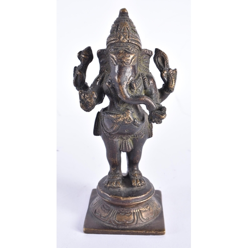 258 - A 19TH CENTURY INDIAN BRONZE FIGURE OF GANESHA modelled upon a square form base. 16 cm high.