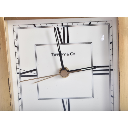 28 - TWO TIFFANY & CO BRASS CLOCKS. 10.5 cm x 9.75 cm. (2)