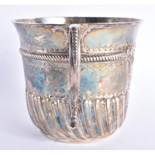 298 - AN EARLY ENGLISH TWIN HANDLED SILVER REPOUSSE PORRINGER decorated with an acanthus capped monogram. ... 