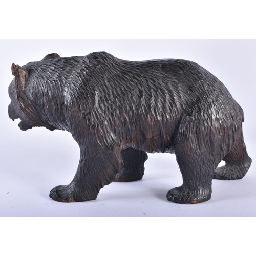 30 - AN ANTIQUE BAVARIAN BLACK FOREST BEAR together with a aeroplane propellor frame. Largest 24 cm x 12 ... 