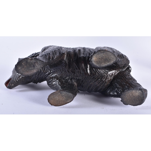 30 - AN ANTIQUE BAVARIAN BLACK FOREST BEAR together with a aeroplane propellor frame. Largest 24 cm x 12 ... 