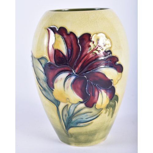 33 - THREE MOORCROFT VASES. Largest 21 cm high. (3)