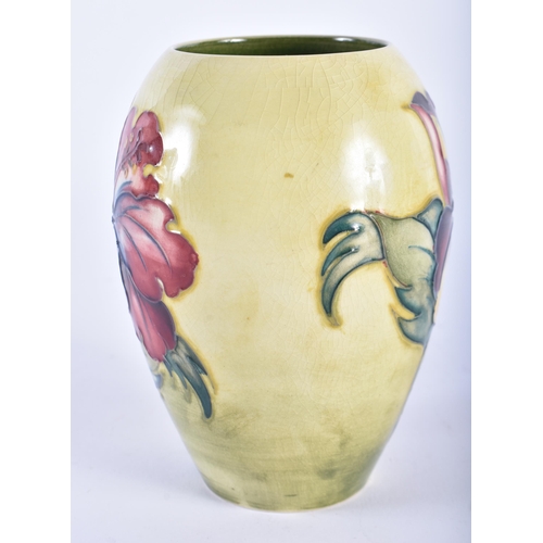 33 - THREE MOORCROFT VASES. Largest 21 cm high. (3)