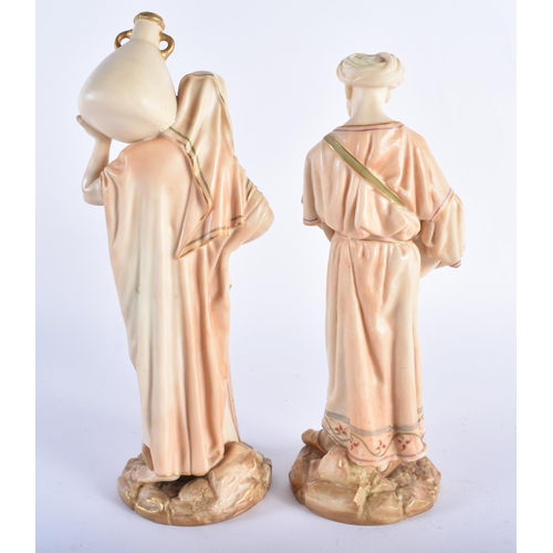 35 - A PAIR OF ROYAL WORCESTER BLUSH IVORY PORCELAIN FIGURES. 24 cm high.