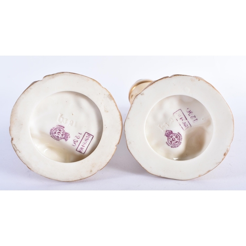 35 - A PAIR OF ROYAL WORCESTER BLUSH IVORY PORCELAIN FIGURES. 24 cm high.