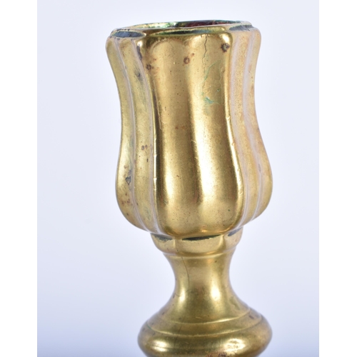 41 - A SMALL PAIR OF ANTIQUE BRASS CANDLESTICKS. 15 cm x 10 cm.