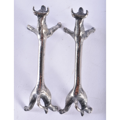 44 - A PAIR OF ART DECO SILVER PLATED BULL KNIFE RESTS. 9 cm wide.