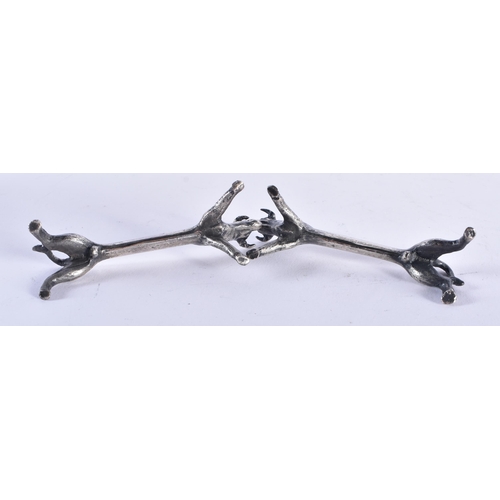 44 - A PAIR OF ART DECO SILVER PLATED BULL KNIFE RESTS. 9 cm wide.