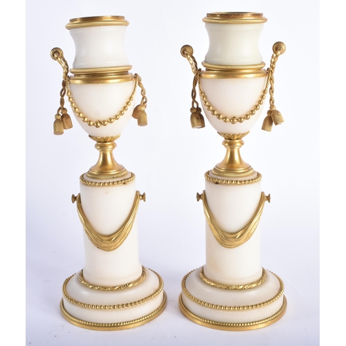 49 - A FINE PAIR OF EARLY 19TH CENTURY FRENCH ORMOLU AND MARBLE CASSOLETTES mounted in draped swags and r... 