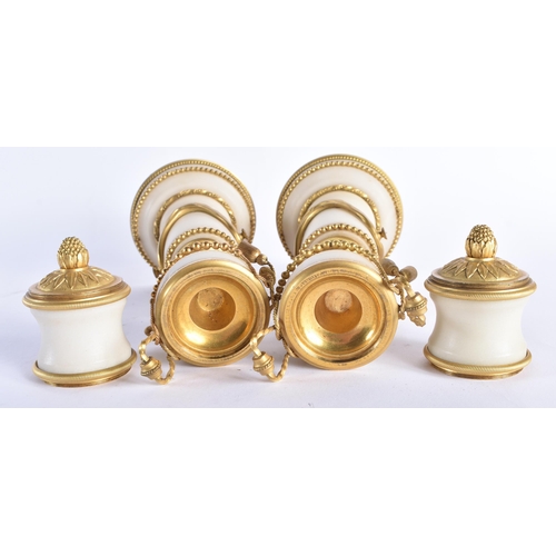 49 - A FINE PAIR OF EARLY 19TH CENTURY FRENCH ORMOLU AND MARBLE CASSOLETTES mounted in draped swags and r... 