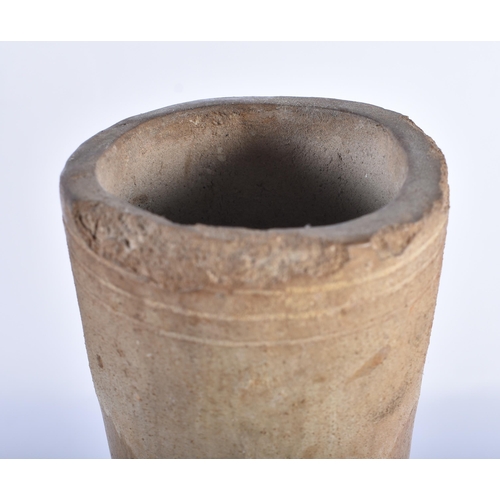 500 - AN EARLY ANTIQUITY POTTERY VASE incised with motifs. 25 cm high.