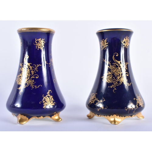 541 - A PAIR OF COALPORT PORCELAIN FLARED VASES. 11 cm high.