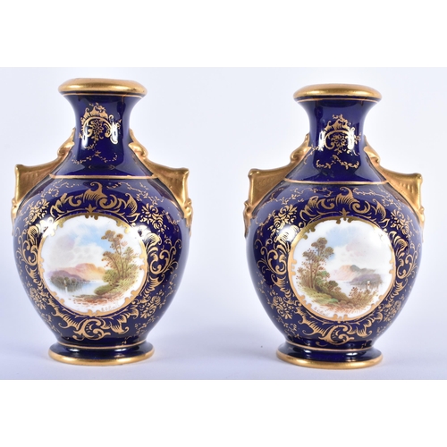 544 - A PAIR OF COALPORT TWIN HANDLED PORCELAIN VASES. 11.5 cm high.