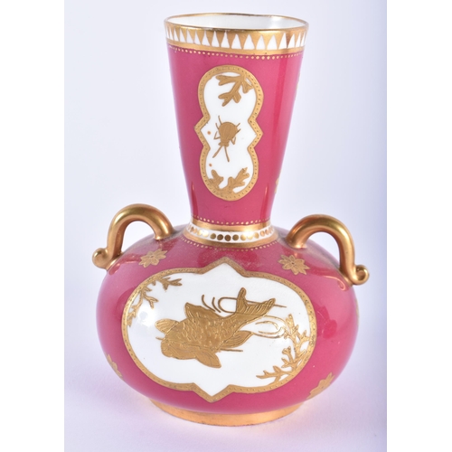 545 - A PAIR OF COALPORT RUBY GROUND PORCELAIN VASES. 12 cm high.