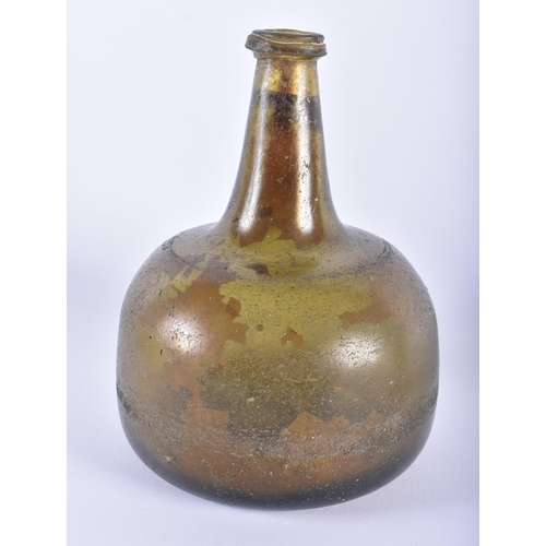 546 - A 17TH/18TH CENTURY IRIDESCENT GLASS ONION FORM WINE BOTTLE together with a later Wickham & Co Ltd b... 