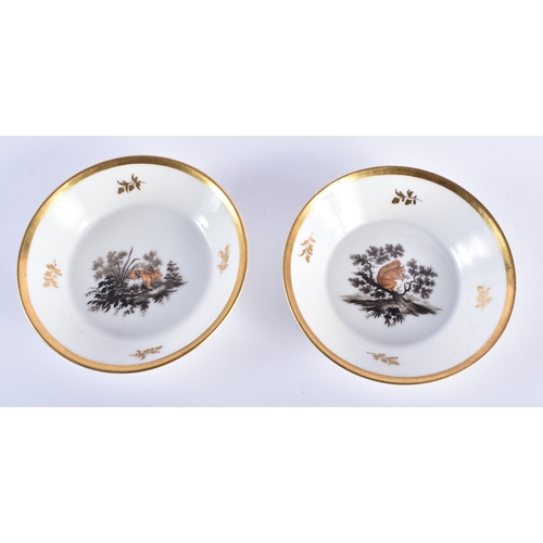 568 - A PAIR OF EARLY 19TH CENTURY PARIS PORCELAIN FABLE SAUCERS. 13 cm diameter.