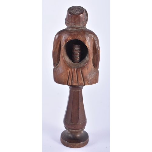 58 - AN ANTIQUE TREEN CARVED WOOD FIGURAL NUT CRACKER. 15.5 cm high.