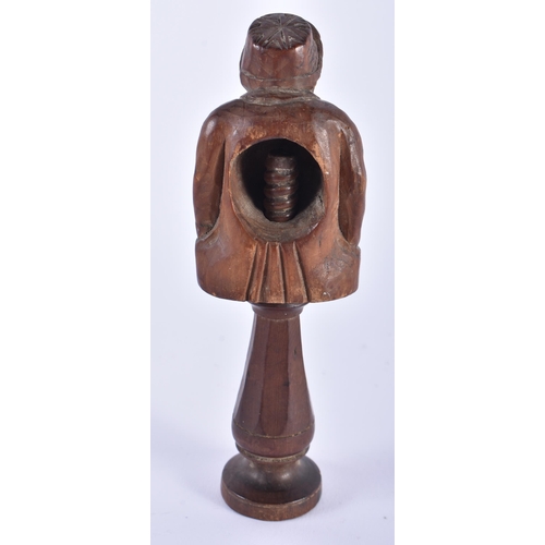 58 - AN ANTIQUE TREEN CARVED WOOD FIGURAL NUT CRACKER. 15.5 cm high.