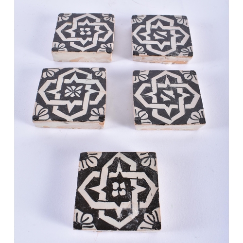 588 - A SET OF FIVE PERSIAN ISLAMIC TILES. 6 cm square. (5)