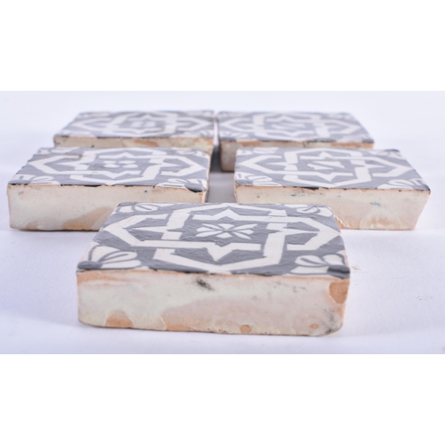 588 - A SET OF FIVE PERSIAN ISLAMIC TILES. 6 cm square. (5)