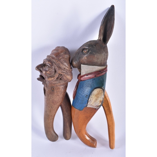 59 - A RARE ANTIQUE PAINTED WOOD TREEN PETER RABBIT NUT CRACKER together with another wood nut cracker. L... 