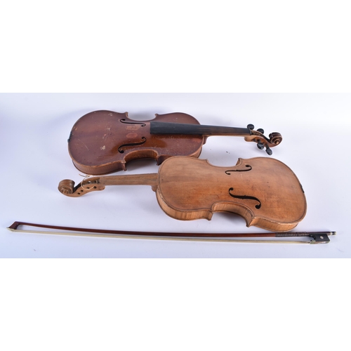 602 - TWO VIOLINS together with a bow. (3)