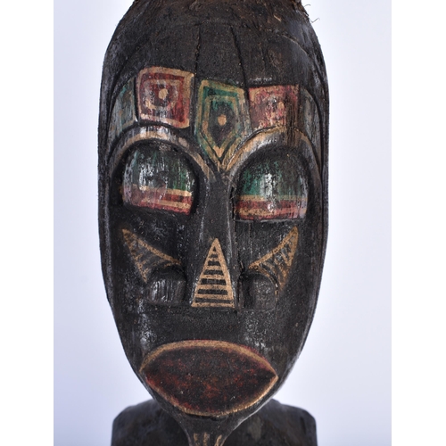 61 - A SET OF THREE CARVED WOOD TRIBAL FIGURES. 50 cm high. (3)