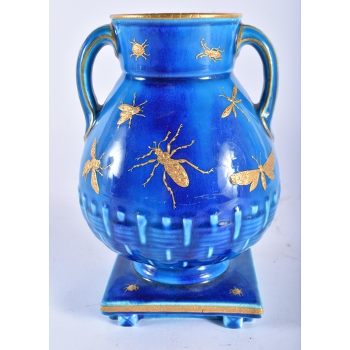 67 - A 19TH CENTURY AESTHETIC MOVEMENT TWIN HANDLED TURQUOISE GLAZED VASE decorated in raised gilt with i... 