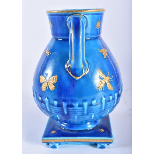 67 - A 19TH CENTURY AESTHETIC MOVEMENT TWIN HANDLED TURQUOISE GLAZED VASE decorated in raised gilt with i... 