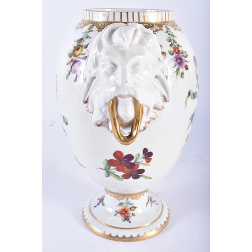 69 - AN 18TH/19TH CENTURY DANISH COPENHAGEN PORCELAIN VASE with mask head handles, painted with flowers. ... 