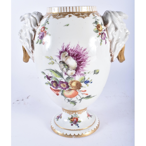 69 - AN 18TH/19TH CENTURY DANISH COPENHAGEN PORCELAIN VASE with mask head handles, painted with flowers. ... 