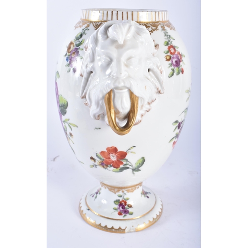 69 - AN 18TH/19TH CENTURY DANISH COPENHAGEN PORCELAIN VASE with mask head handles, painted with flowers. ... 