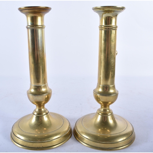 703 - A PAIR OF ANTIQUE ADJUSTABLE BRASS CANDLESTICKS. 21.5 cm high.