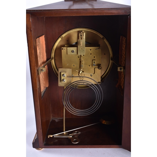 803 - AN ANTIQUE MAHOGANY MANTEL CLOCK together with an Atmos clock. Largest 38 cm high inc handle. (2)