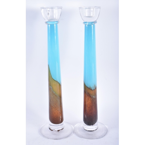 804 - A STYLISH PAIR OF ICEY BLUE GLASS CANDLE HOLDERS. 40 cm high.