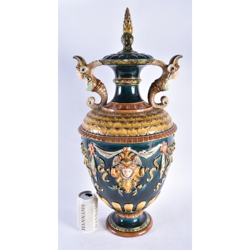 814 - A LARGE 19TH CENTURY AUSTRIAN MAJOLICA TWIN HANDLED VASE AND COVER decorated with mask heads. 62 cm ... 