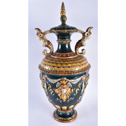 814 - A LARGE 19TH CENTURY AUSTRIAN MAJOLICA TWIN HANDLED VASE AND COVER decorated with mask heads. 62 cm ... 