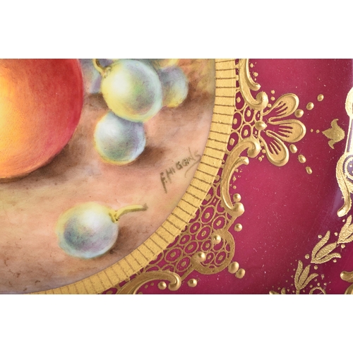8 - A ROYAL WORCESTER MAROON GROUND PORCELAIN CABINET PLATE by Higgins. 21.5 cm wide.