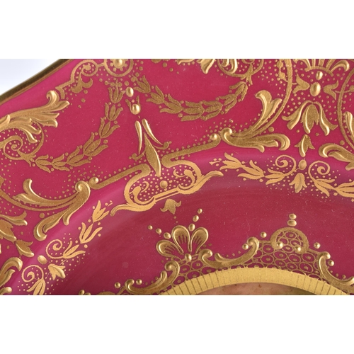 8 - A ROYAL WORCESTER MAROON GROUND PORCELAIN CABINET PLATE by Higgins. 21.5 cm wide.