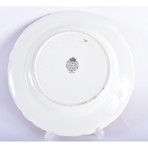 8 - A ROYAL WORCESTER MAROON GROUND PORCELAIN CABINET PLATE by Higgins. 21.5 cm wide.