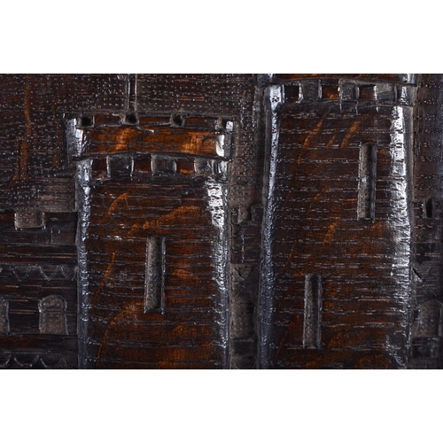 84 - AN ANTIQUE CARVED TREEN OAK WOOD PANEL OF KENILWORTH CASTLE. 34 cm x 28 cm.