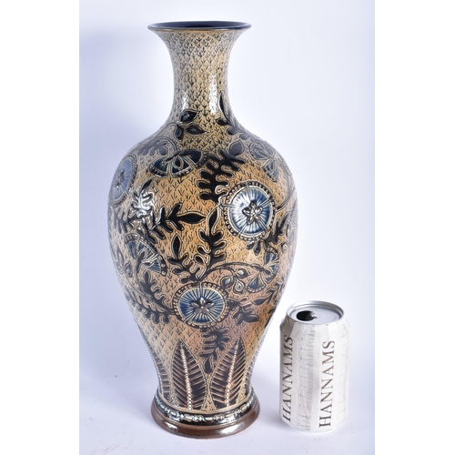 91 - A LARGE DOULTON STONEWARE BALUSTER VASE decorated with roundels and foliage. 38 cm high.