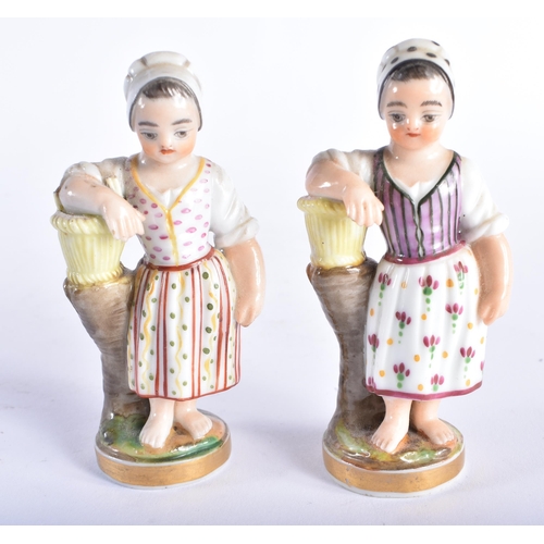 96 - A SMALL PAIR OF 19TH CENTURY CONTINENTAL PORCELAIN FIGURES modelled as children beside baskets. 9.5 ... 