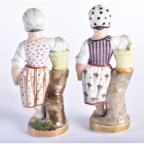 96 - A SMALL PAIR OF 19TH CENTURY CONTINENTAL PORCELAIN FIGURES modelled as children beside baskets. 9.5 ... 