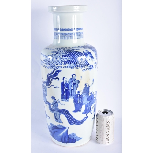 2015 - A LARGE CHINESE BLUE AND WHITE PORCELAIN ROULEAU VASE probably 19th century, painted with immortals ... 