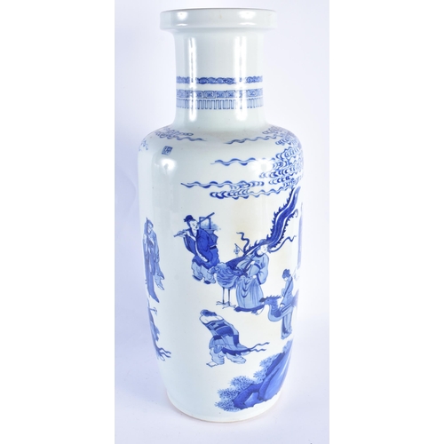 2015 - A LARGE CHINESE BLUE AND WHITE PORCELAIN ROULEAU VASE probably 19th century, painted with immortals ... 