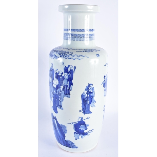 2015 - A LARGE CHINESE BLUE AND WHITE PORCELAIN ROULEAU VASE probably 19th century, painted with immortals ... 