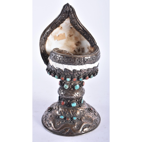 2194 - AN UNUSUAL 19TH CENTURY TIBETAN SILVER MOUNTED SHELL inset with coral and turquoise. 724 grams overa... 