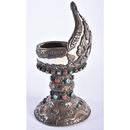 2194 - AN UNUSUAL 19TH CENTURY TIBETAN SILVER MOUNTED SHELL inset with coral and turquoise. 724 grams overa... 