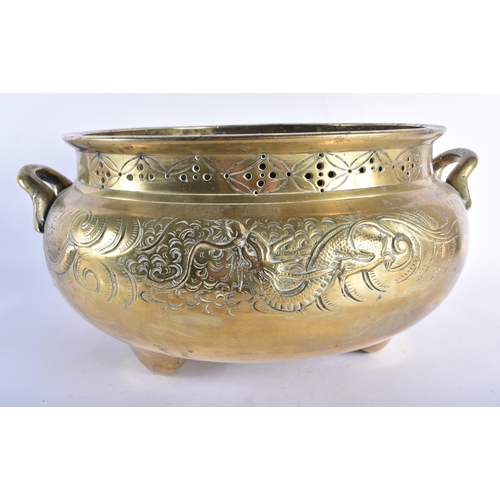 2206 - A LARGE 19TH CENTURY JAPANESE MEIJI PERIOD TWIN HANDLED BRONZE JARDINIERE decorated with dragons. 45... 